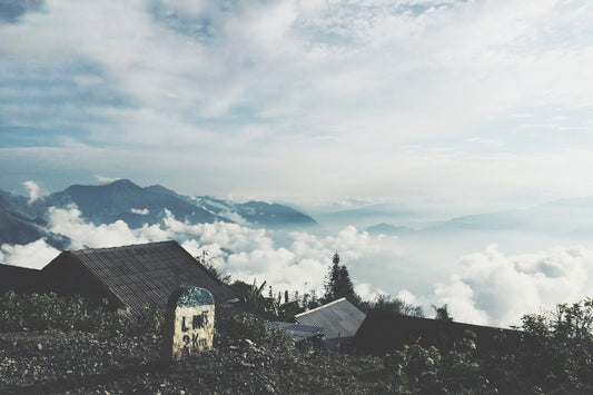 black house overlooking clouds