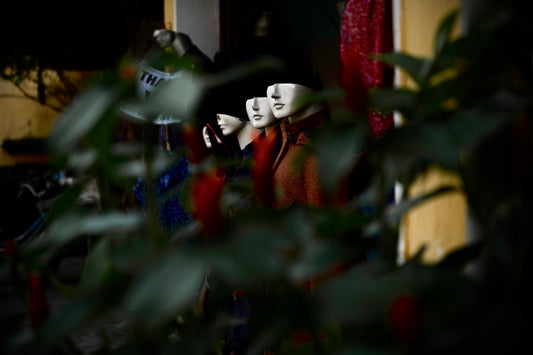 a couple of mannequins sitting next to each other