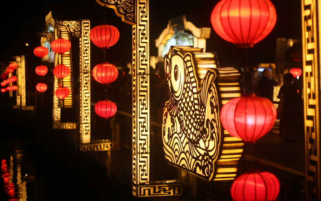 a row of red lanterns hanging from the ceiling