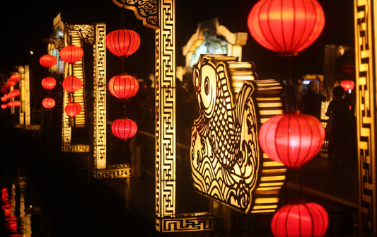 a row of red lanterns hanging from the ceiling