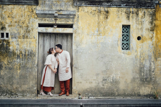 a man and a woman standing in front of a door