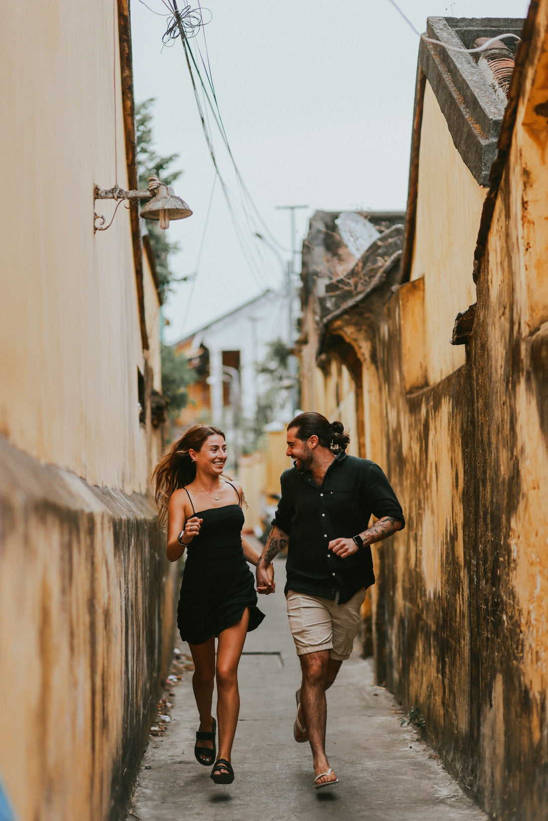 a man and a woman walking down a street