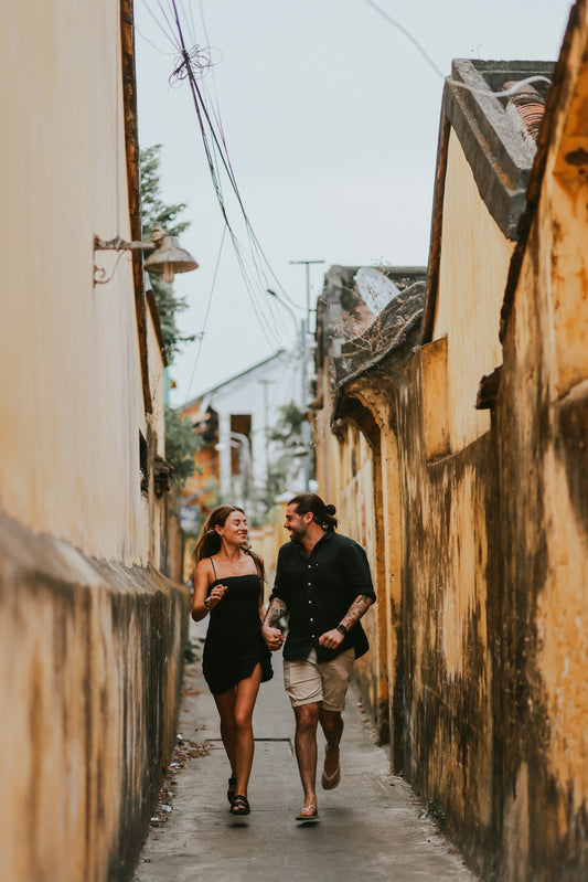 a man and a woman walking down a street