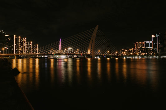 A night view of a city and a bridge