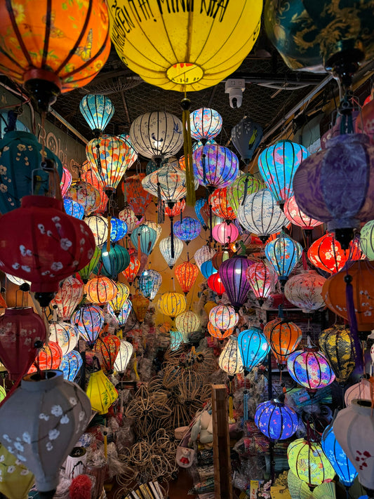A room filled with lots of different colored lanterns