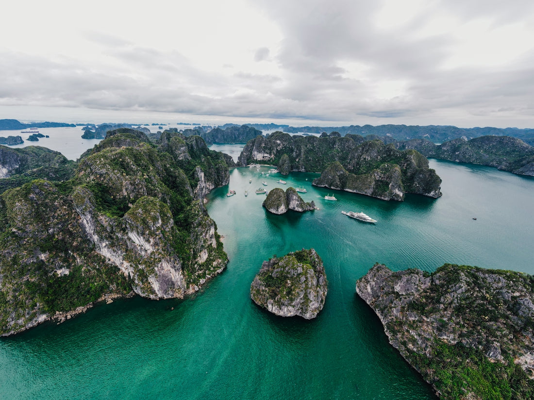 Dramatic coastline and islands in a tranquil sea.